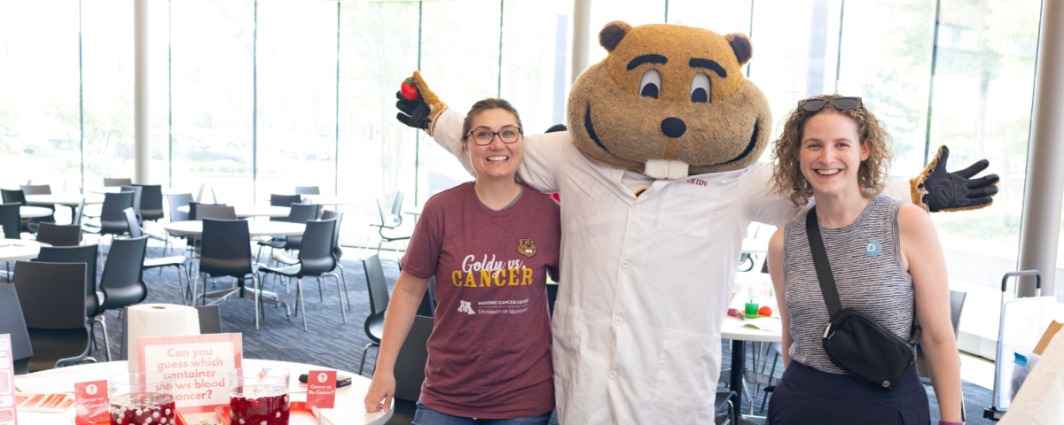 Goldy with Event Volunteer and atendee